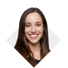 A woman with light brown straight hair smiling and wearing a black shirt